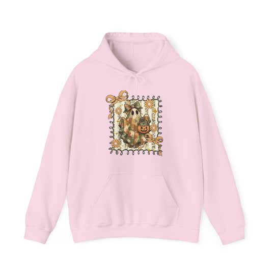 Quilted Ghost Hoodie with whimsical Halloween print, featuring a ghost with jack-o’-lantern, framed by vines and flowers, on a light-pink background.