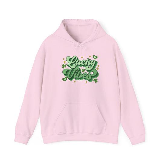 Good Day Lucky Day Hoodie: Pink sweatshirt featuring green text, unisex heavy blend with kangaroo pocket and matching drawstring, ideal for warmth and casual style.