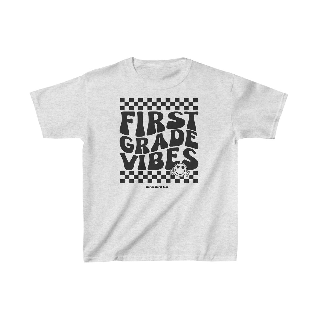 Kids 1st Grade Vibes Tee, white shirt with black text, 100% cotton, light fabric, classic fit, tear-away label, sizes XS to XL. Ideal for everyday wear, durable with no side seams.