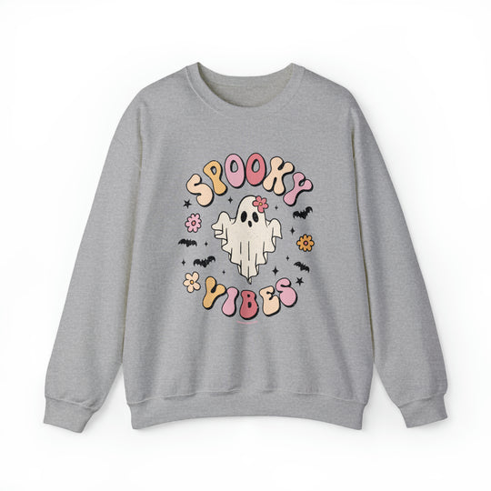 A grey crewneck sweatshirt featuring a ghost and bats design, embodying spooky vibes. Unisex, heavy blend fabric with ribbed knit collar for comfort. Perfect for casual wear.