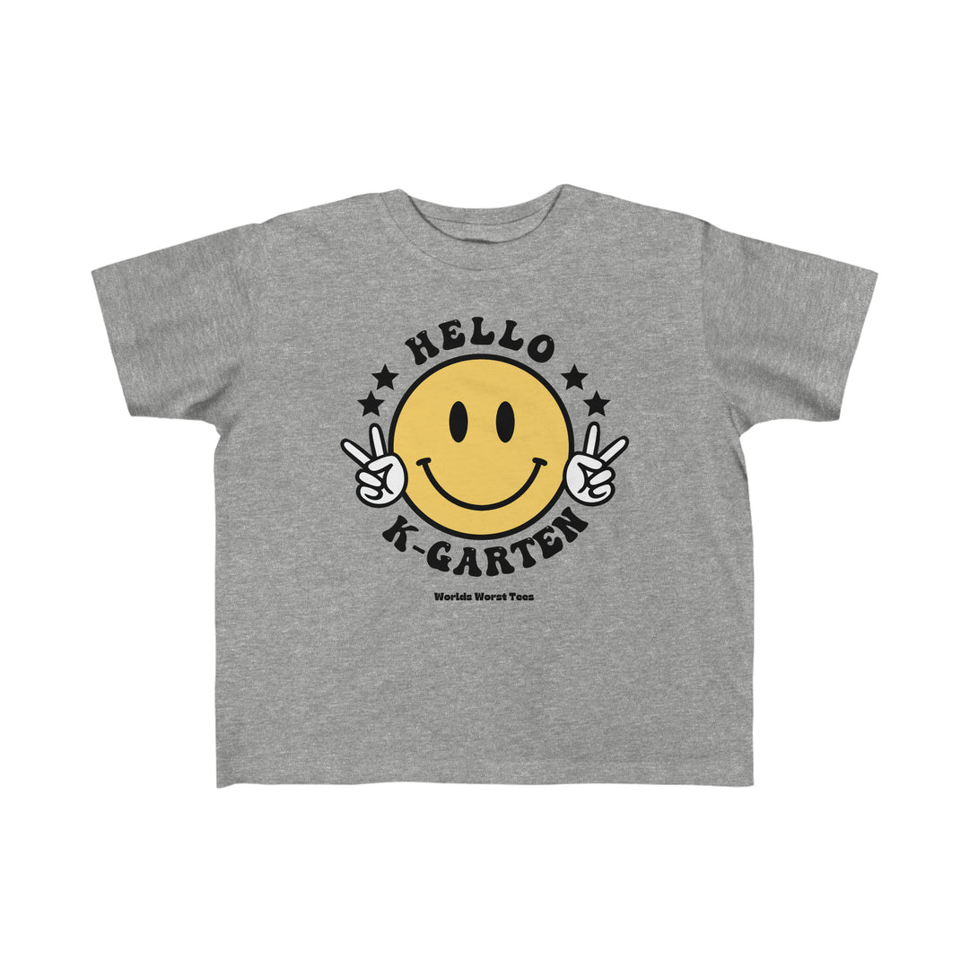 Hello Kindergarten Toddler Tee featuring a grey t-shirt with a yellow smiley face and black text. Made of 100% combed ringspun cotton, light fabric, classic fit, tear-away label. Ideal for toddlers.