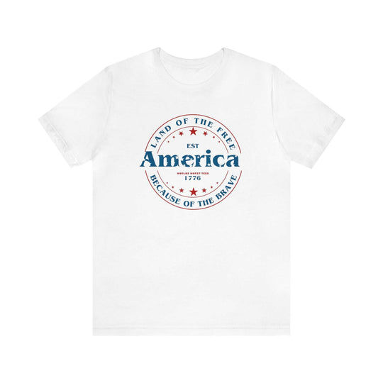 A classic America Land of the Free Tee in white with red and blue text. Unisex jersey tee made of 100% cotton, featuring ribbed knit collars and taping on shoulders for a comfortable fit.