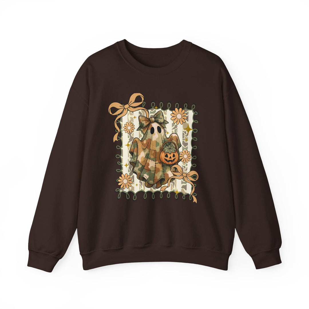 Quilted Ghost Crew sweatshirt features a camo-tone patchwork ghost with bow and jack-o’-lantern, surrounded by orange bows and flowers on a dark-brown backdrop.