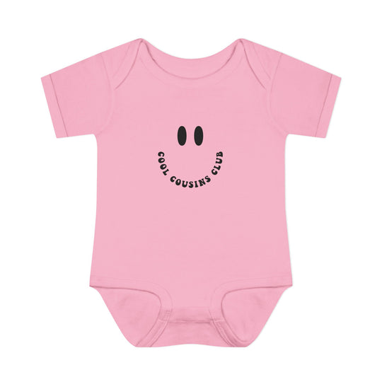 Cool Cousins Club Onesie: Soft, ring-spun cotton bodysuit with lap shoulders for easy adjustment, designed for infants' comfort and movement, unisex fit, tear-away label.