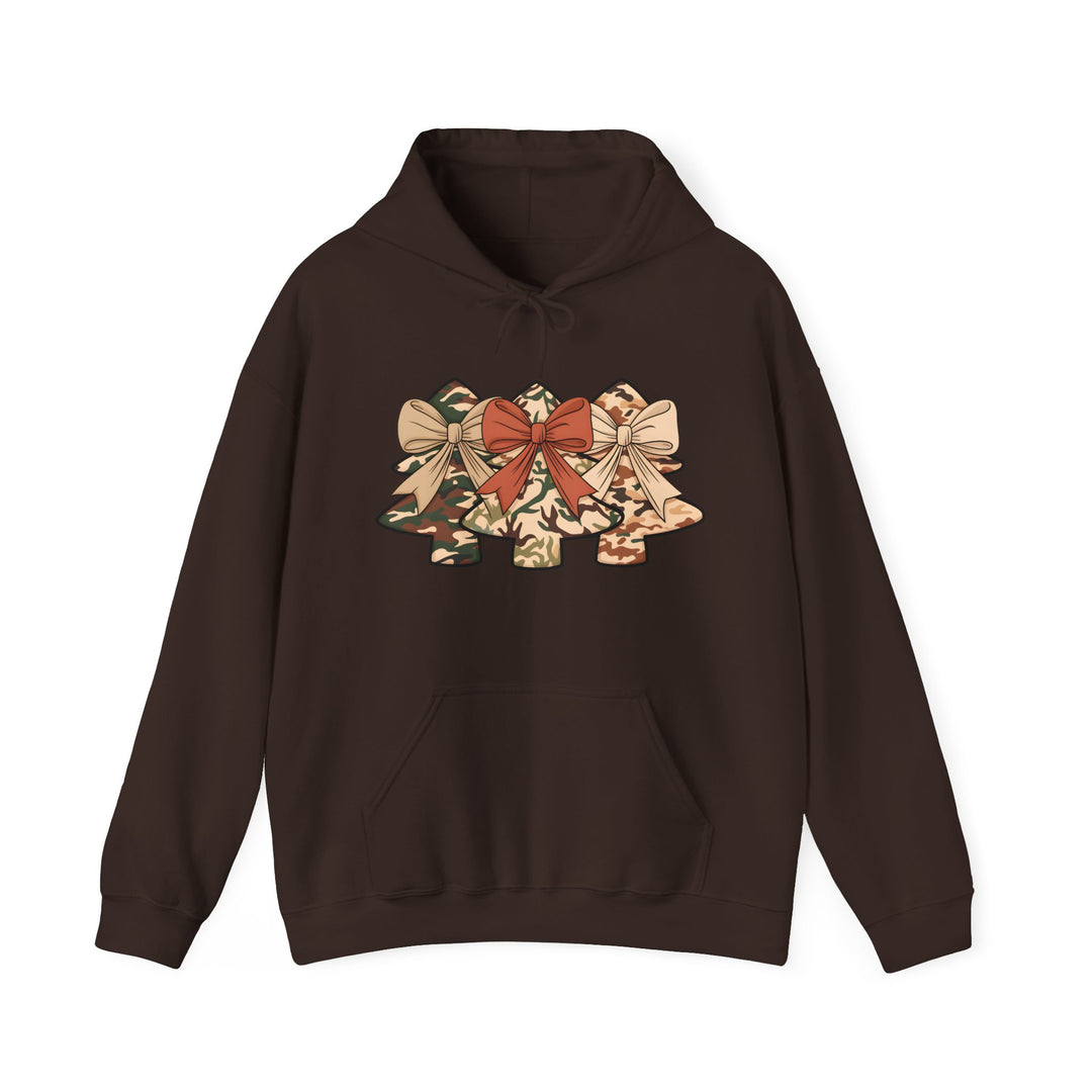 Camo Christmas Tree Hoodie featuring stylized tree silhouettes in earth-tone camouflage with decorative bows, kangaroo pocket, and drawstring hood.