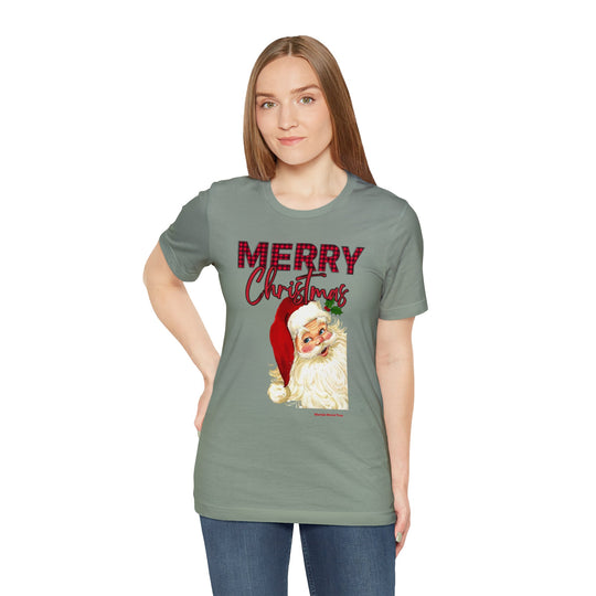 Unisex Christmas Santa Tee, featuring a woman in a green shirt with Santa Claus print. Airlume cotton, ribbed collar, retail fit. Sizes XS-5XL. Worlds Worst Tees store.