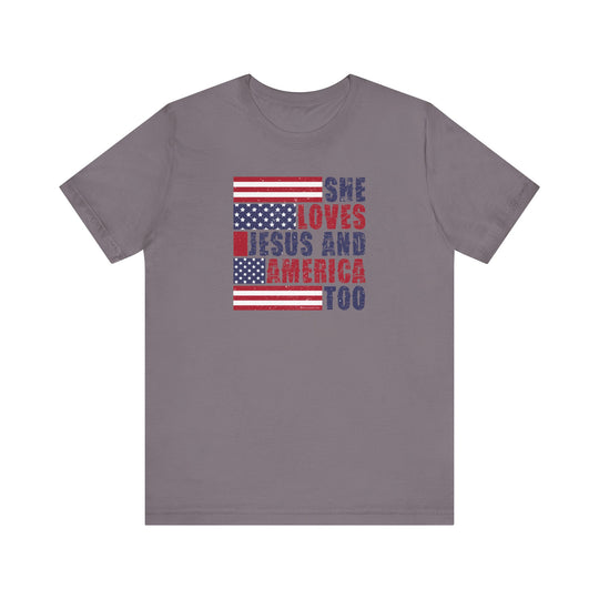 A classic She Loves Jesus and America Tee in grey, featuring red and blue text. Unisex jersey shirt with ribbed knit collars, 100% Airlume combed cotton, and tear away label. Sizes XS to 3XL.