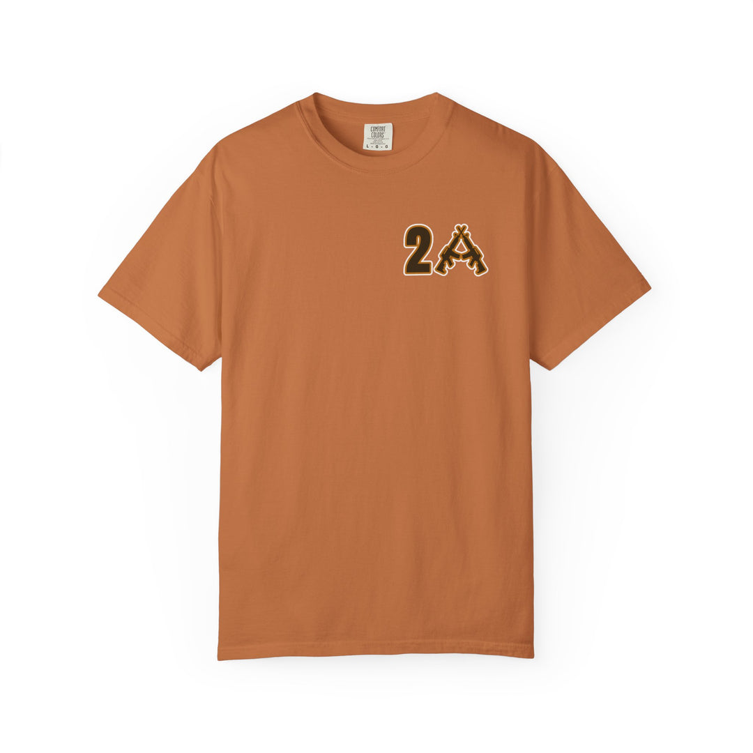 Burnt-orange short-sleeved Comfort Colors tee with 2A graphic, featuring crossed rifles, reflecting a unique and casual style.