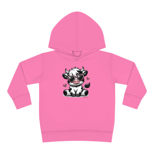 Toddler hoodie featuring a cute cow design, ideal for comfort with jersey-lined hood, cover-stitched details, and side seam pockets. Made of 60% cotton, 40% polyester blend. Dimensions: 2T - 15.62L x 14.50W x 12.00SL. From 'Worlds Worst Tees'.