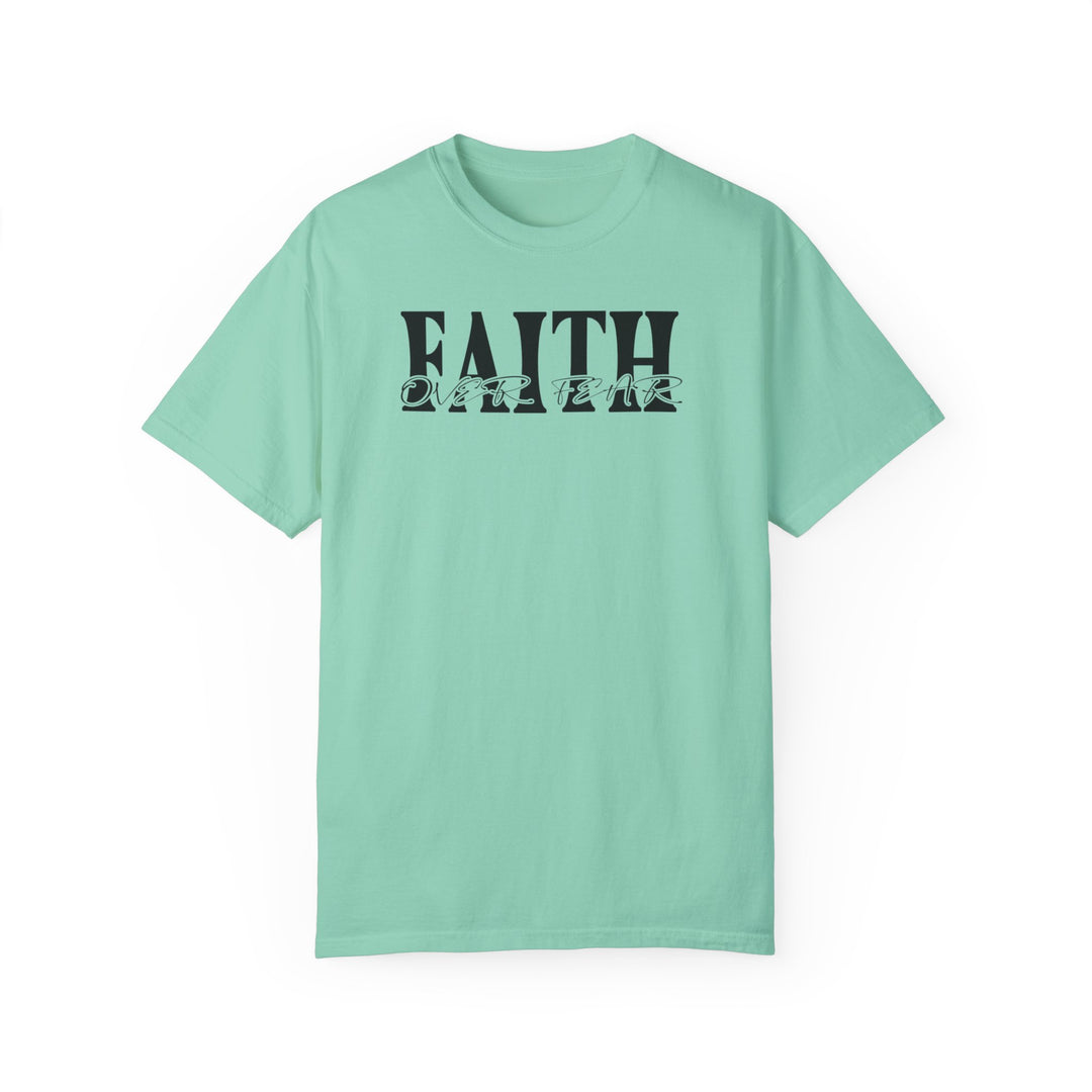 A light green Faith Over Fear Tee, featuring black text, made of 100% ring-spun cotton. Relaxed fit, double-needle stitching, and no side-seams for durability and comfort. From Worlds Worst Tees.