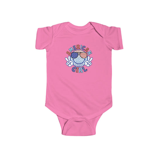 American Girl Onesie featuring a pink baby bodysuit with a peace sign, sunglasses, and a cartoon image. Made of 100% cotton, light fabric, with ribbed bindings and plastic snaps for easy changing access. Ideal for infants.