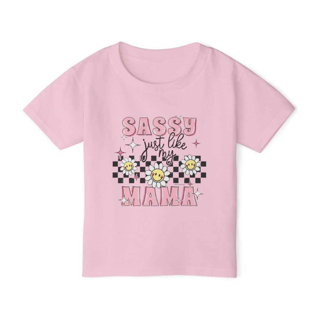 Toddler tee with a pink sun and checkered pattern, featuring a flower with a smiley face. Made of 100% cotton for softness and comfort. Classic fit with rib collar. Sassy Just Like My Mama Toddler Tee.