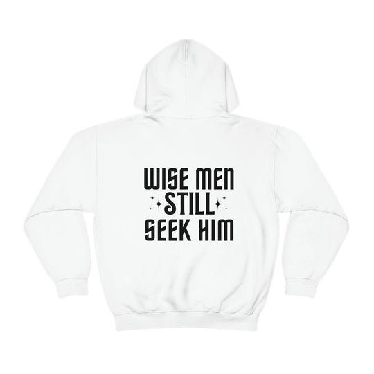 A Wise Men Still Seek Him hoodie in white, with black text. Unisex heavy blend, cotton-polyester fabric, kangaroo pocket, drawstring hood. Classic fit, tear-away label, true to size.
