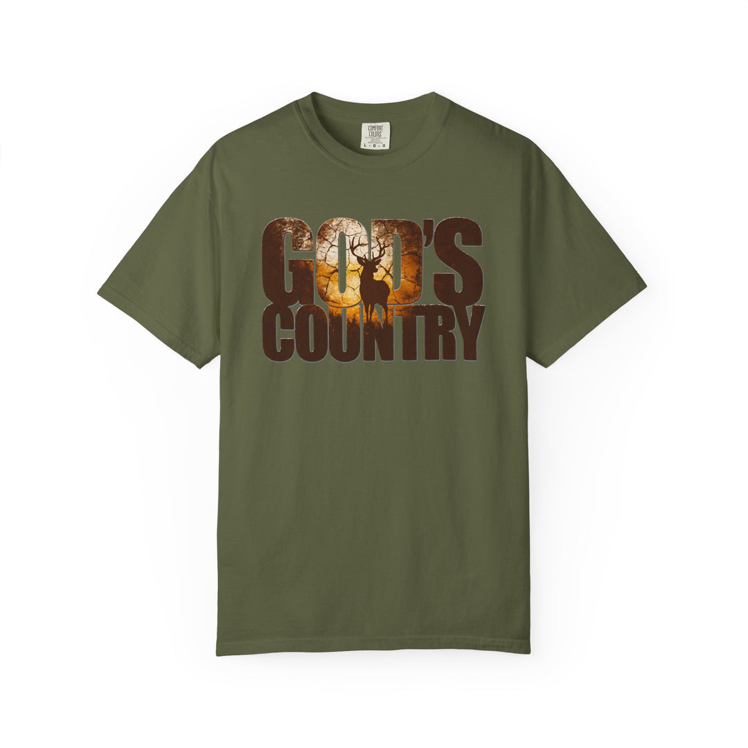 Olive-green God's Country tee with woodland scene and deer silhouette, embodying rustic charm and comfort from Comfort Colors, ideal for casual and semi-formal wear.