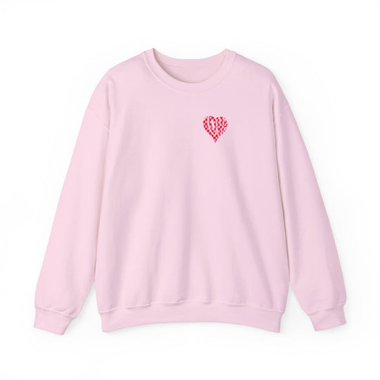 Unisex Love Crew pink sweatshirt with heart design. Heavy blend fabric, ribbed knit collar, no itchy seams. 50% cotton, 50% polyester. Loose fit, sewn-in label. Sizes S-5XL.