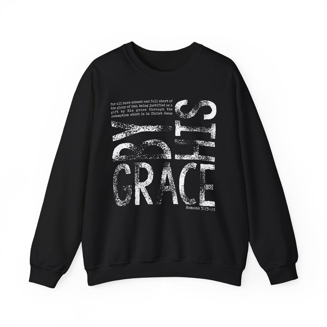 Black crew-neck sweatshirt with By Grace and Romans 3:23-24 in distressed white text, combining comfort and faith-inspired style.