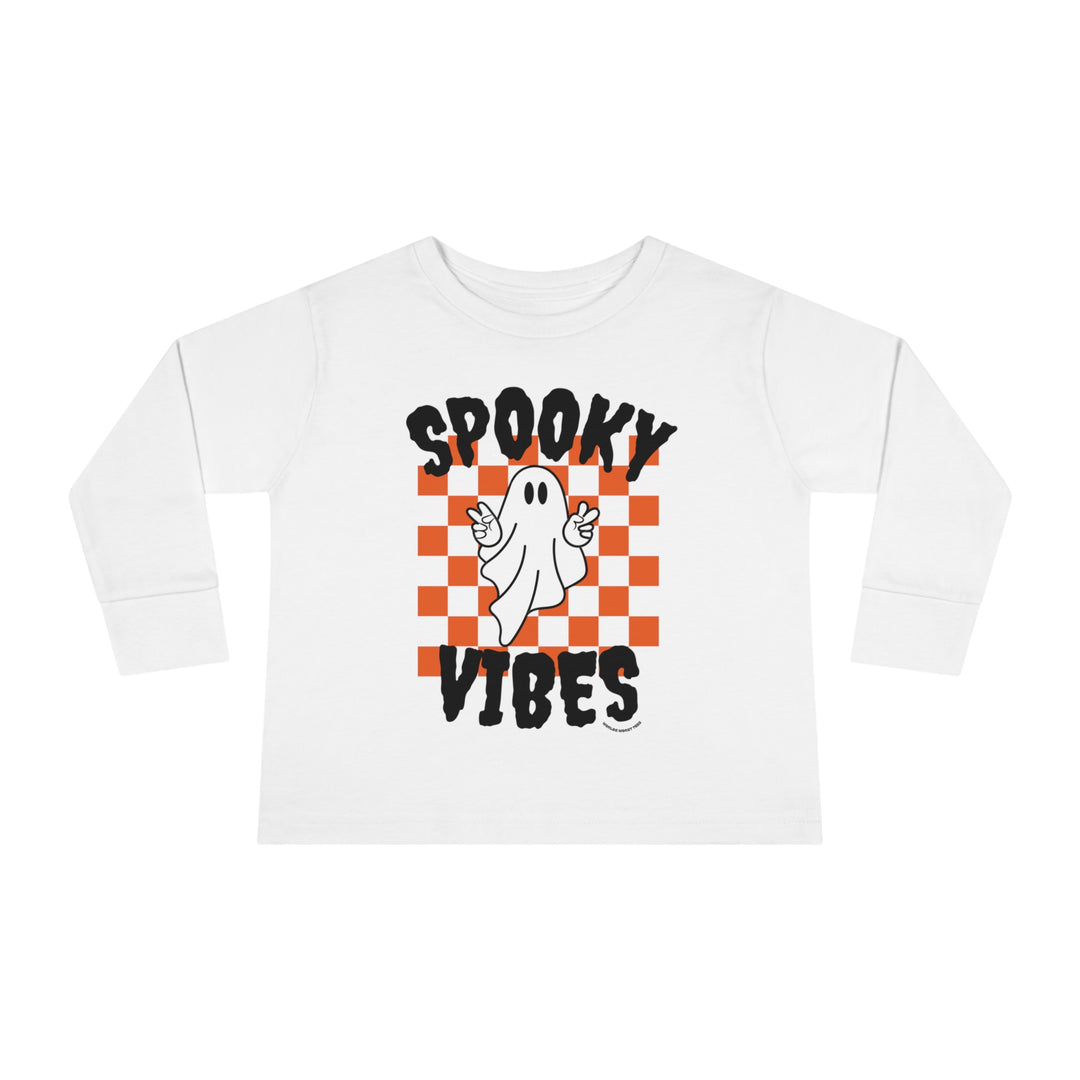 A spooky vibes toddler long sleeve tee featuring a white shirt with a ghost design. Made of 100% combed ringspun cotton, with a ribbed collar and shoulder-to-shoulder taping for durability and comfort.