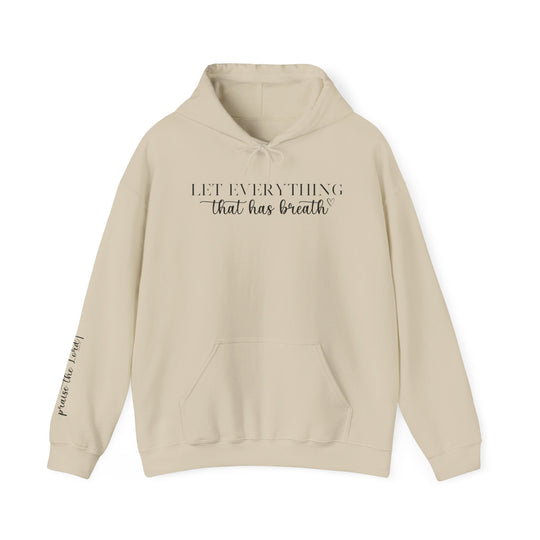 A beige unisex heavy blend hooded sweatshirt featuring the Let Everything That Has Breath Praise the Lord design. Made of 50% cotton and 50% polyester, with a kangaroo pocket and matching drawstring. Classic fit, medium-heavy fabric.