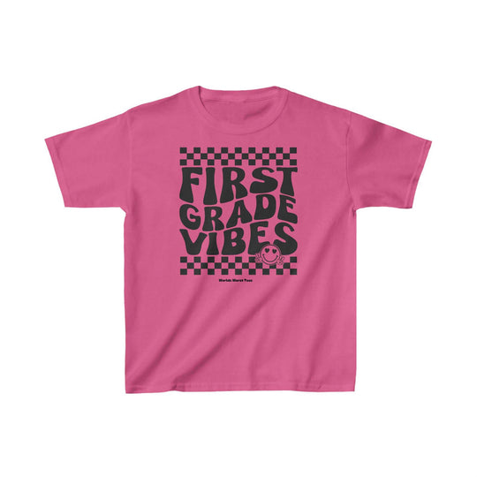 Kids 1st Grade Vibes Tee, pink shirt with black text. 100% cotton, light fabric, classic fit, tear-away label. Ideal for printing, durable twill tape shoulders, curl-resistant collar.