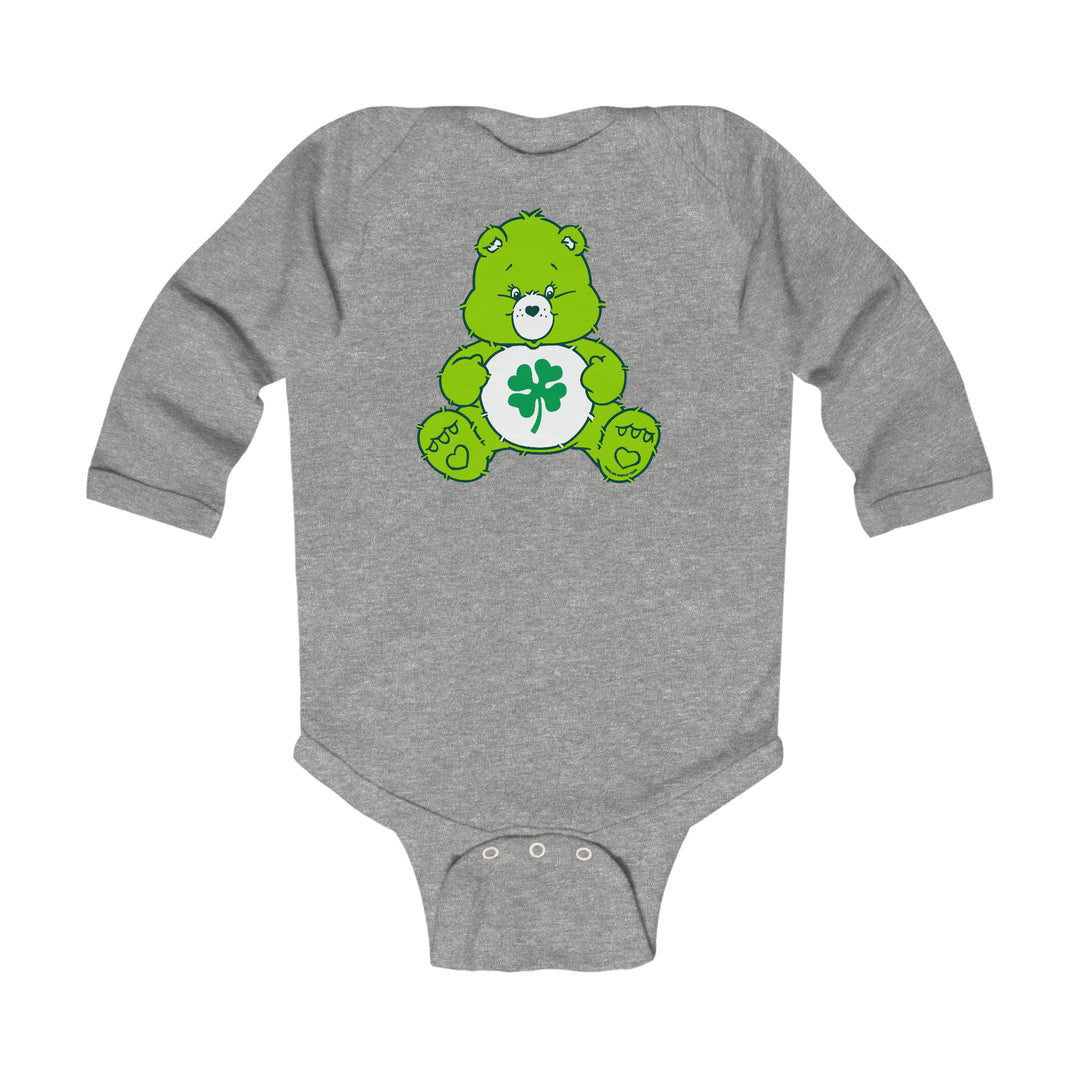 A Lucky Bear Onesie for infants, featuring a green bear design on a grey bodysuit. Made of soft, durable cotton with plastic snaps for easy changing. Ideal for comfort and style.