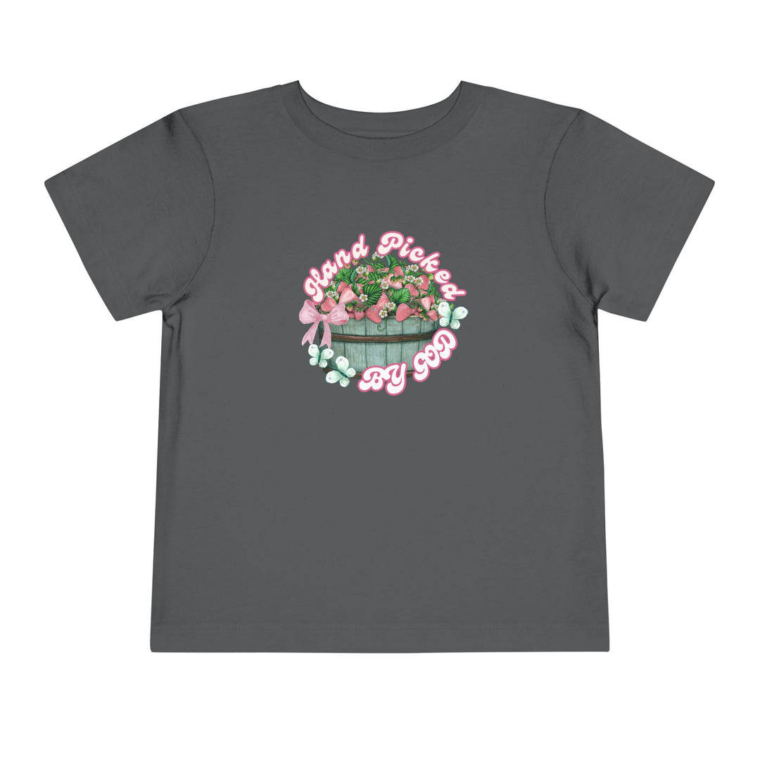 Toddler wearing Hand Picked by GOD t-shirt, showcasing its soft, 100% Airlume cotton fabric, ideal for everyday comfort.