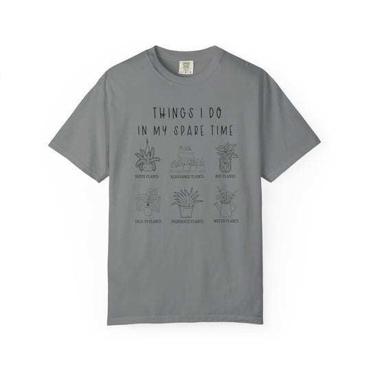 Heather-gray Plants Spare Time Tee featuring a plant-lover's bucket list with six illustrated tasks like repotting and watering plants, perfect for casual, comfortable wear.