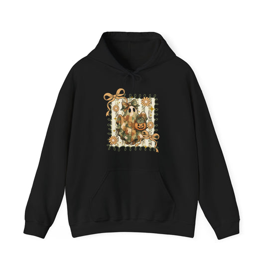 Black pullover hoodie with a Halloween-themed graphic of a ghost holding a pumpkin lantern, framed by green vines and autumn flowers, titled Quilted Ghost Hoodie.