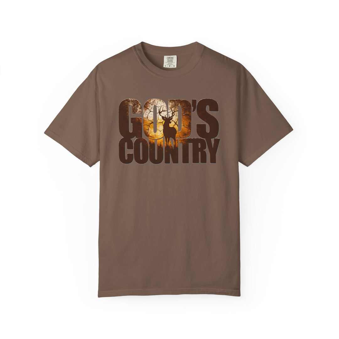 God's Country Tee featuring a sunset forest and buck silhouette in block letters, short-sleeved, relaxed fit, durable Comfort Colors brand.