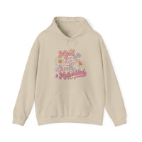 A beige Mind Your Motherhood Hoodie, featuring pink and white text, a hood with drawstring, and a kangaroo pocket. Unisex heavy blend fabric for warmth and comfort. Perfect for chilly days.