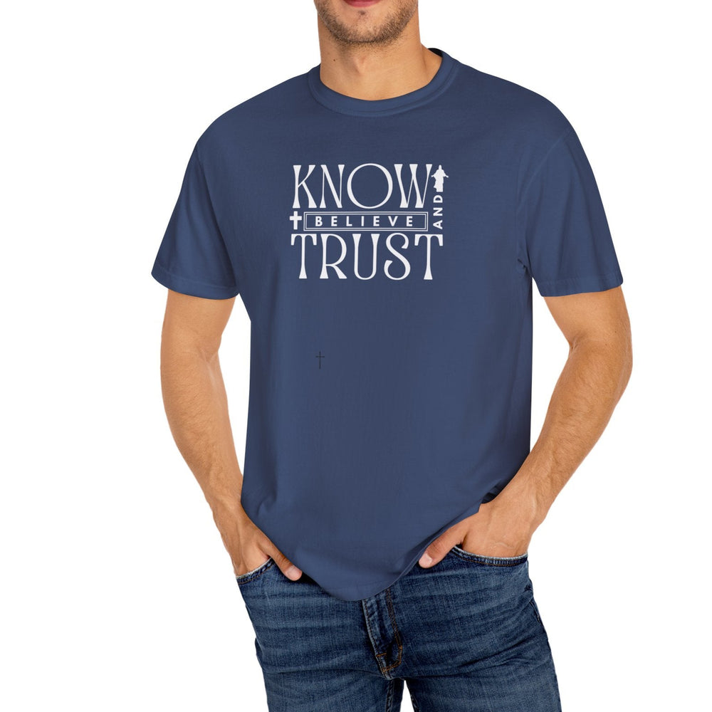 Close-up of a man wearing the Know, Trust, Believe Tee, showcasing the shirt's relaxed fit and durable, soft-washed, garment-dyed fabric.