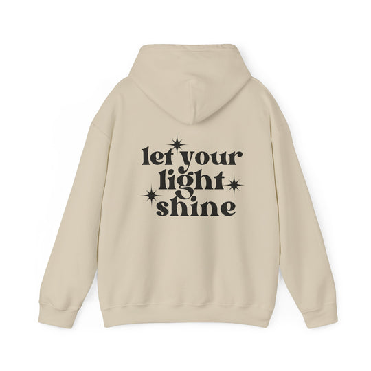 Unisex Let Your Light Shine Hoodie, white with black text, medium-heavy cotton-polyester blend, kangaroo pocket, drawstring hood. Cozy and stylish for cold days. From Worlds Worst Tees.