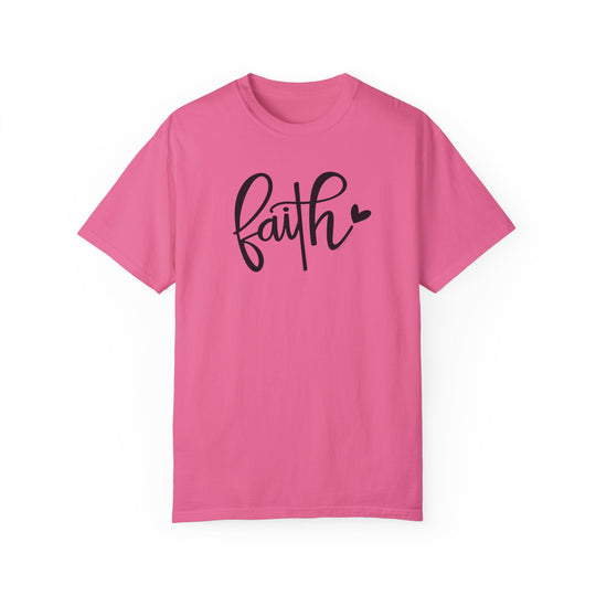 A cozy Faith Tee in pink with black text, made of 100% ring-spun cotton. Relaxed fit, double-needle stitching for durability, and seamless design for a tubular shape. Ideal for daily wear.