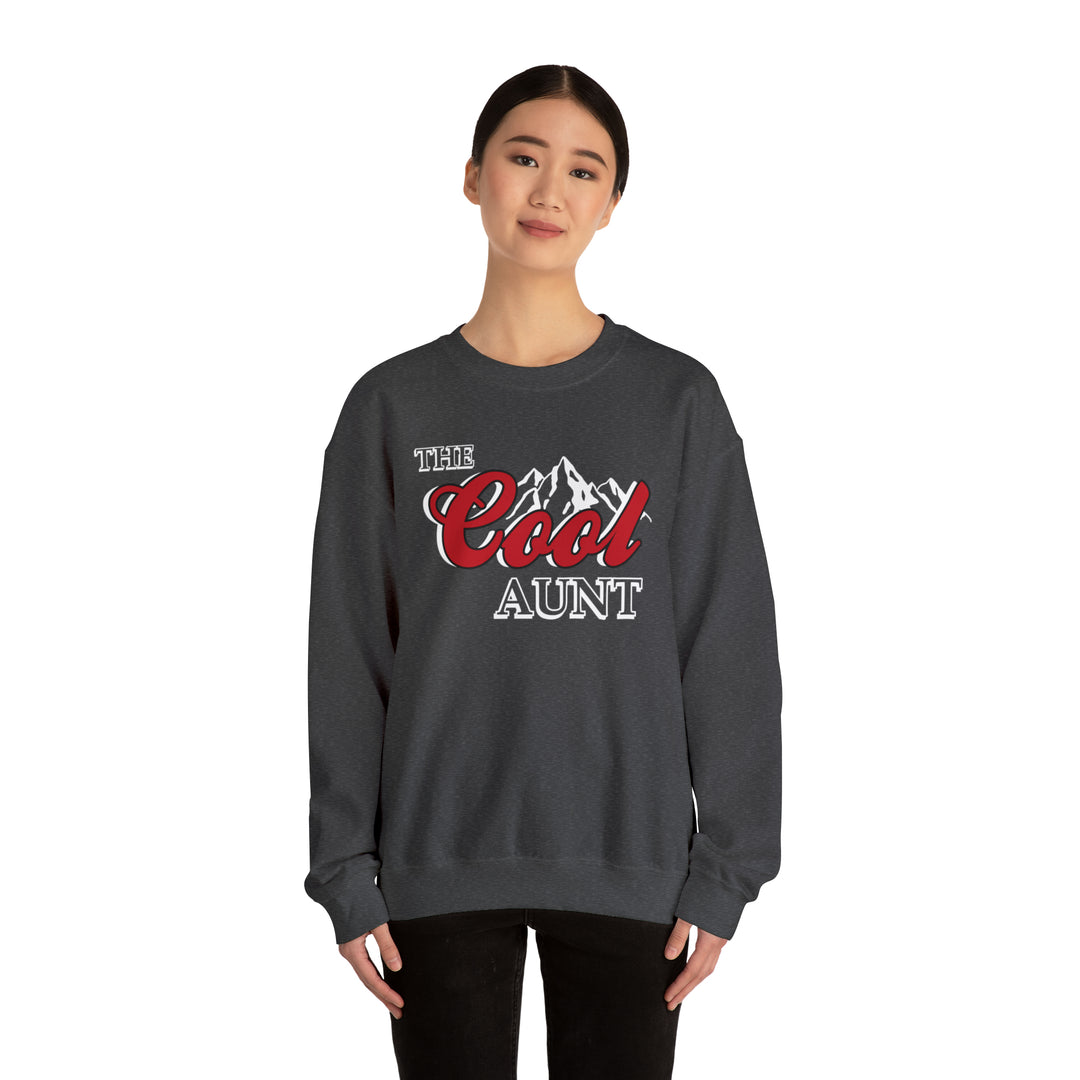 A unisex heavy blend crewneck sweatshirt, The Cool Aunt Crew, in grey. Features ribbed knit collar, no itchy side seams, 50% cotton, 50% polyester, loose fit, sewn-in label. Ideal for comfort and style.