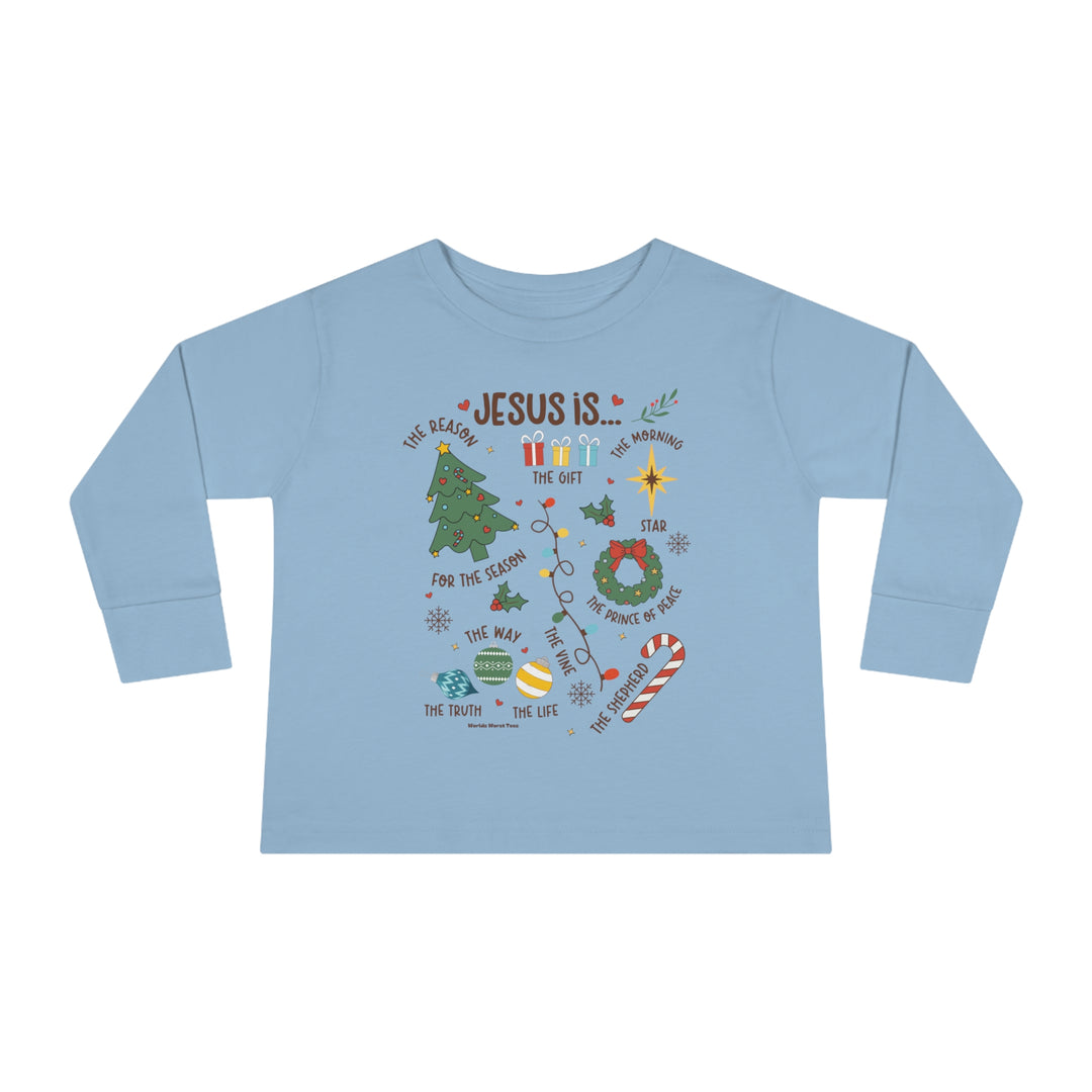 A durable Jesus is Christmas toddler long sleeve tee made of 100% cotton, featuring a graphic design with words and a tree. Designed for comfort and style, perfect for the youngest trendsetters.