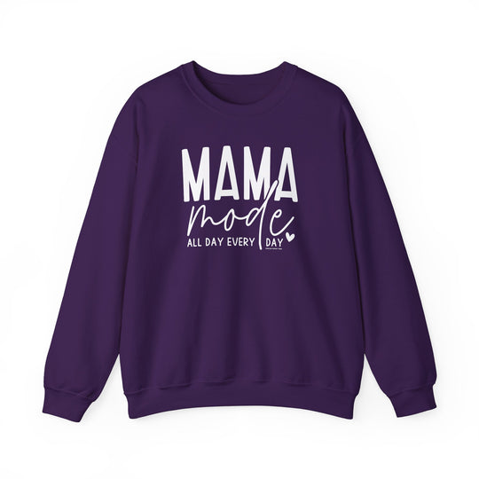 A unisex heavy blend crewneck sweatshirt in purple with white text, ideal for any situation. Made of 50% cotton, 50% polyester, medium-heavy fabric, loose fit, ribbed knit collar, and no itchy side seams. Mama Mode Crew.