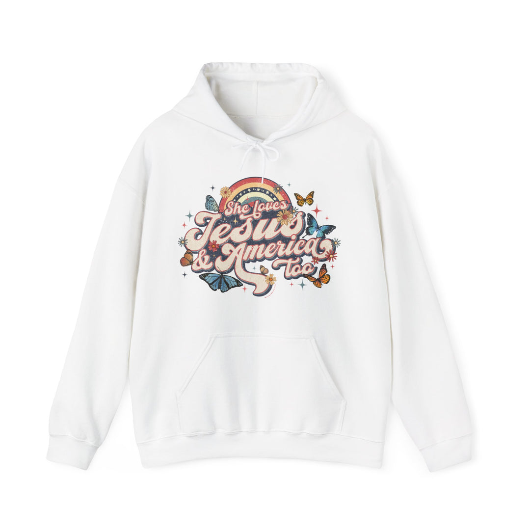 A white She Loves Jesus and America hoodie with a graphic design of butterflies and flowers. Unisex heavy blend hooded sweatshirt in cotton and polyester, featuring a kangaroo pocket and drawstring hood.