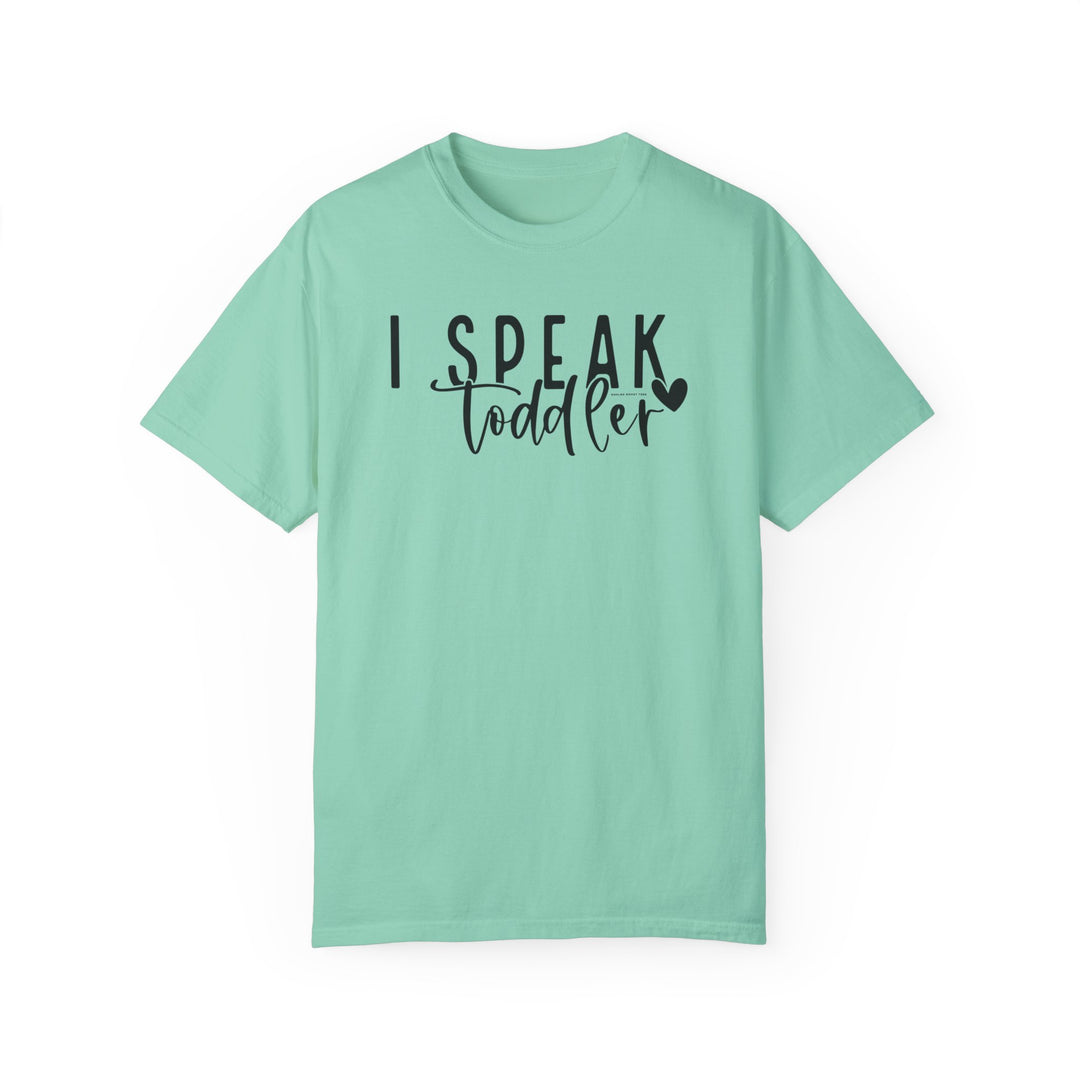 Relaxed fit I Speak Toddler Tee in green with black text. 100% ring-spun cotton, garment-dyed for coziness. Double-needle stitching for durability, no side-seams for shape retention. From Worlds Worst Tees.