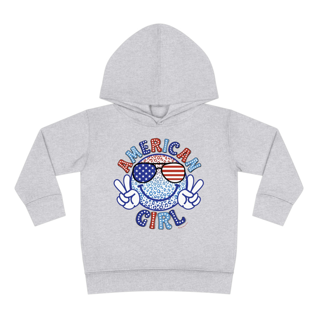 American Girl Toddler Hoodie featuring a grey hoodie with a smiley face and sunglasses design. Designed for comfort with side seam pockets and durable stitching. Perfect for cozy days.