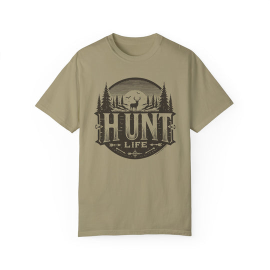 A Hunt Life Tee, featuring a graphic design of a deer and trees on a garment-dyed, ring-spun cotton t-shirt. Relaxed fit, double-needle stitching, and seamless sides for durability and comfort.