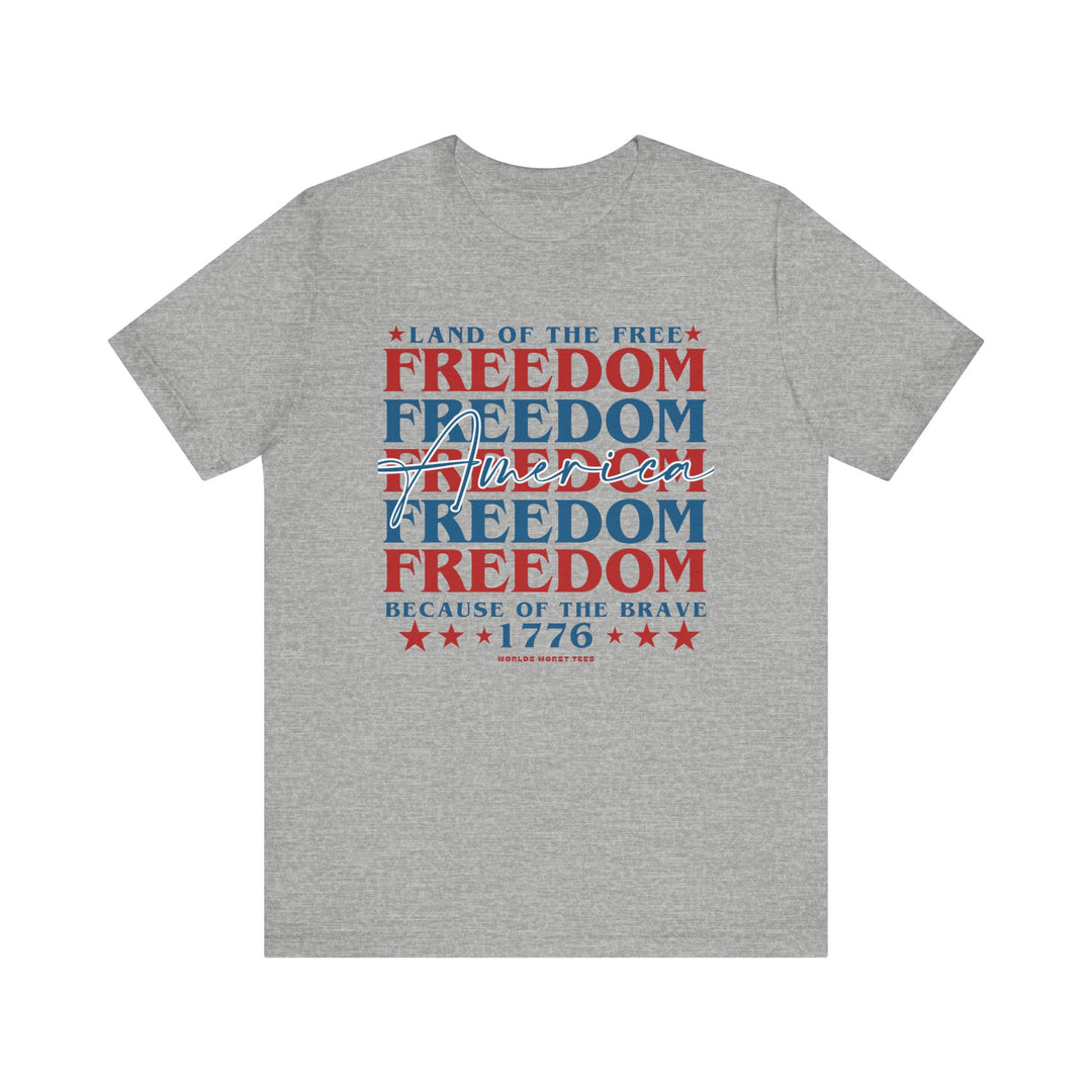 American Freedom Tee: Unisex jersey t-shirt with red and blue text. Airlume combed cotton, ribbed knit collar, taping on shoulders, and dual side seams for durability. Retail fit, light fabric. Sizes XS-3XL.