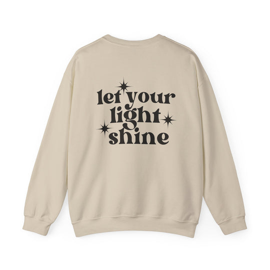 A tan unisex crewneck sweatshirt with black text, featuring a comfortable, medium-heavy fabric blend of 50% Cotton and 50% Polyester. Ribbed knit collar, loose fit, and no itchy side seams. Ideal for all occasions.