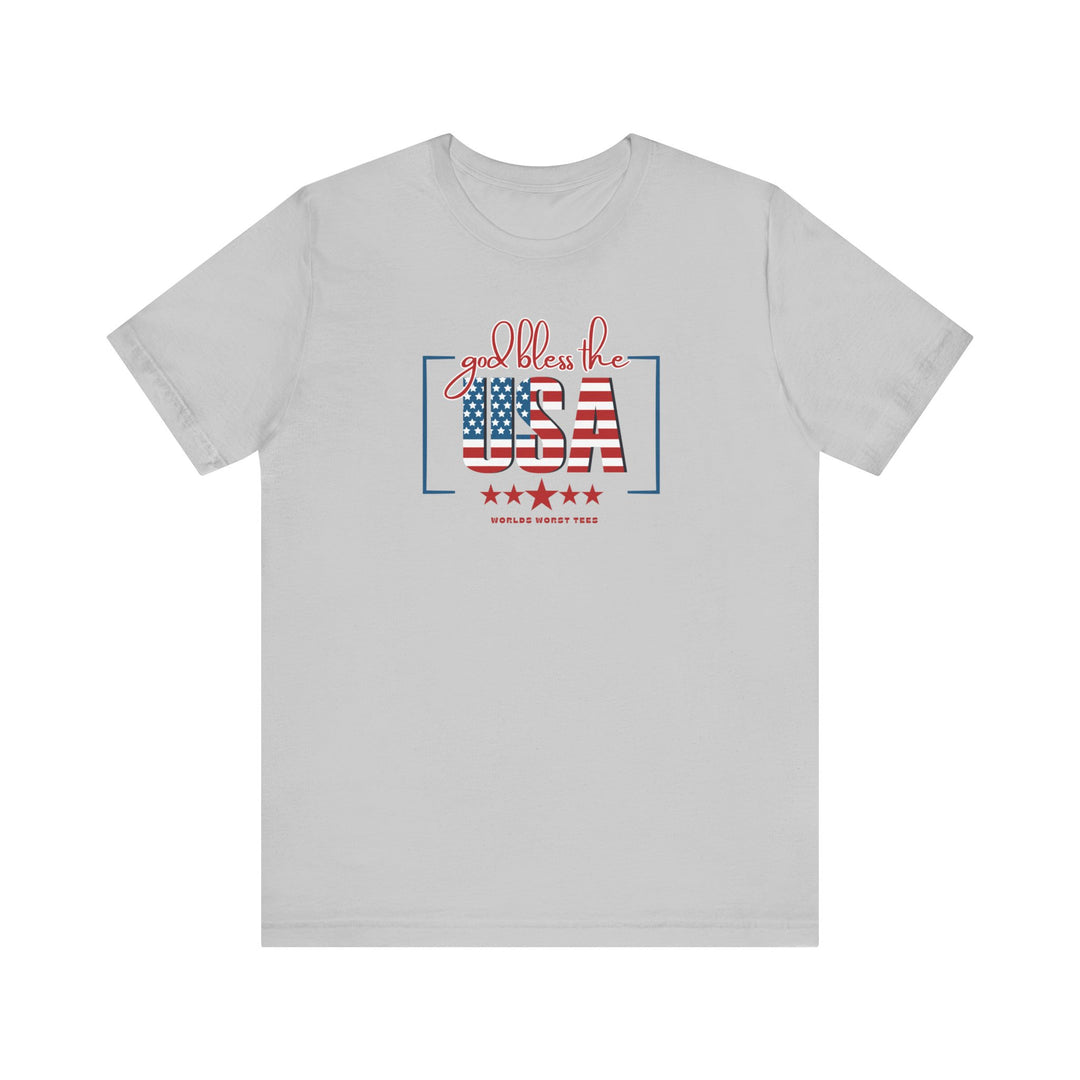 A patriotic God Bless the USA Tee, featuring red, white, and blue text on a white shirt. Unisex jersey tee with ribbed knit collar, quality print, and 100% cotton fabric. Retail fit, true to size.