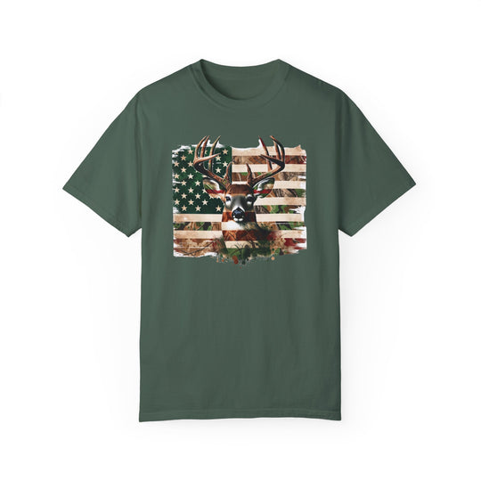 Deer Flag Tee: A green shirt featuring a deer and flag design, made of 100% ring-spun cotton for cozy comfort. Relaxed fit with double-needle stitching for durability, embodying the essence of Worlds Worst Tees.