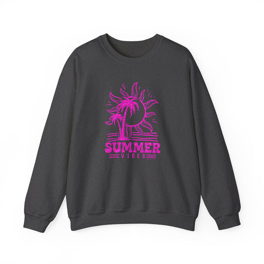 A grey crewneck sweatshirt featuring a pink sun and palm trees, embodying summer vibes. Unisex heavy blend for ultimate comfort, ribbed knit collar, and seamless design for a fresh look. From Worlds Worst Tees.