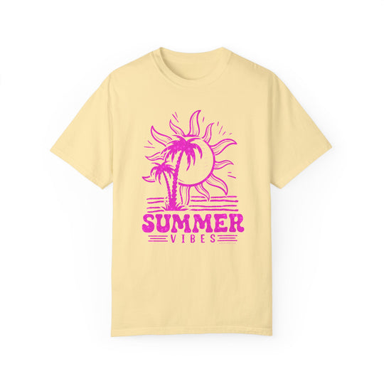 A relaxed fit Summer Vibes Tee, featuring a yellow shirt with a pink sun and palm trees design. Made of 100% ring-spun cotton for coziness, with double-needle stitching for durability.