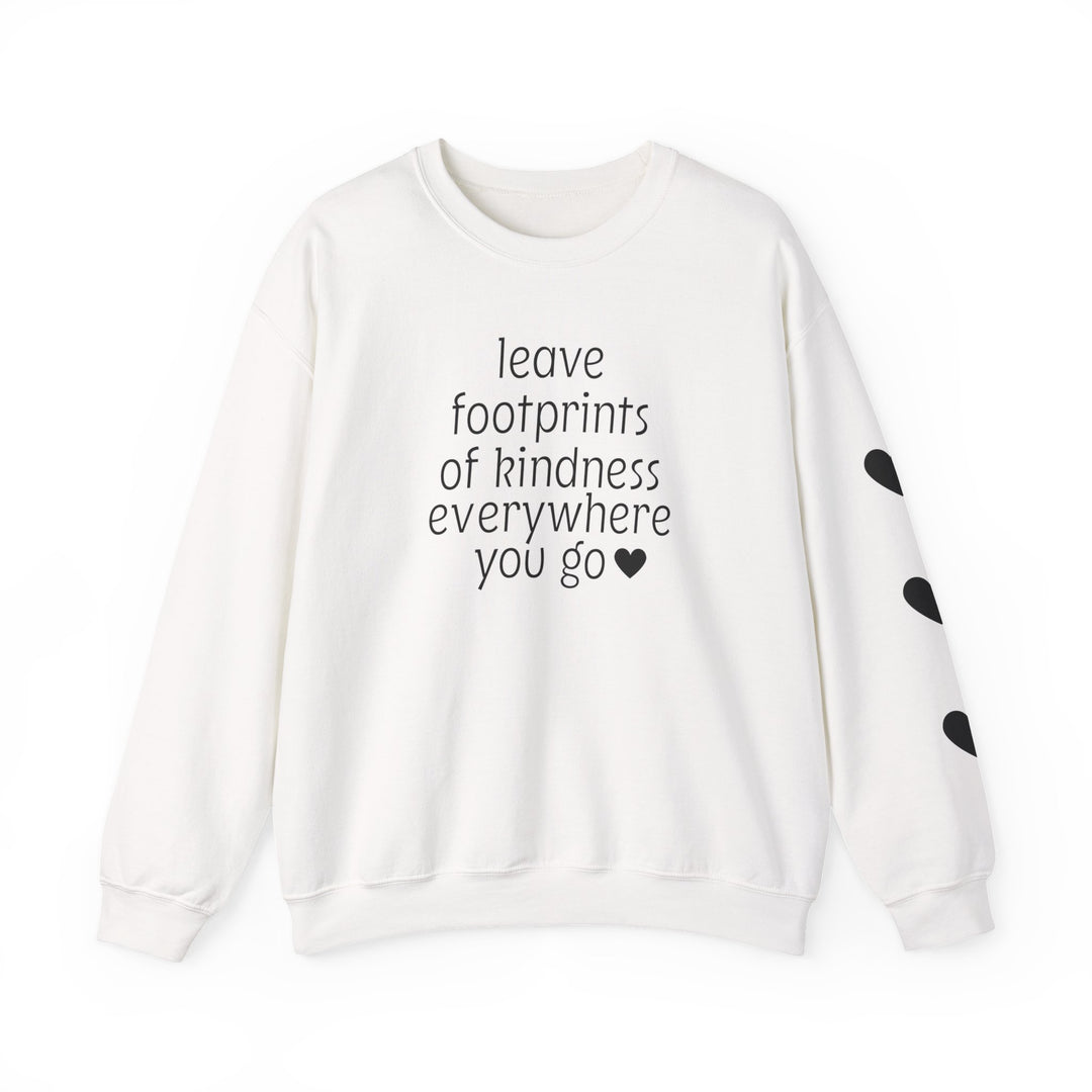 White crew-neck sweatshirt with leave footprints of kindness everywhere you go and black hearts on sleeve, offering comfort and style from Worlds Worst Tees.