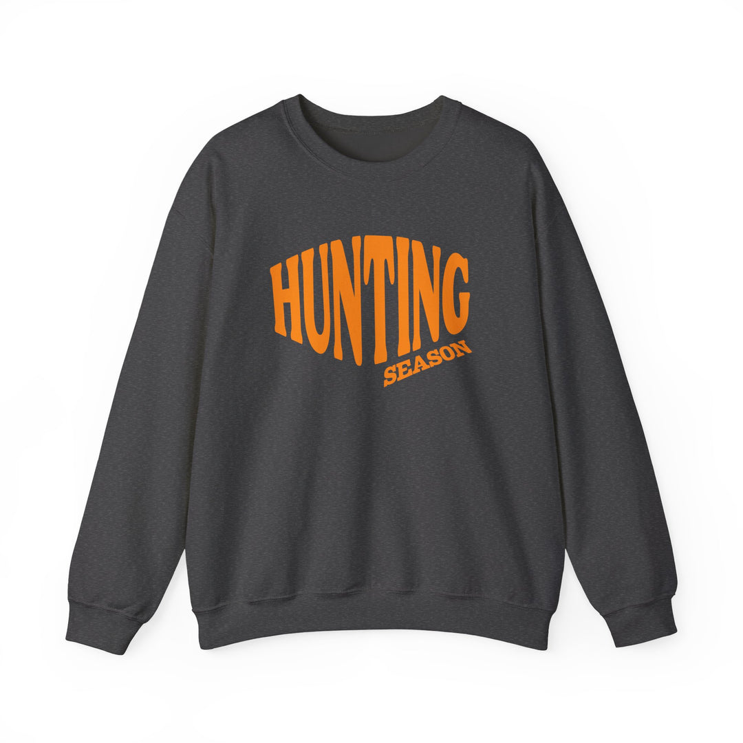 Dark charcoal-gray sweatshirt reads HUNTING in bold orange, SEASON beneath. Unisex, cozy blend, perfect for colder months, featuring durable stitching and a classic fit.