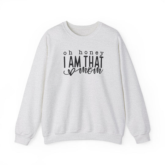 A unisex heavy blend crewneck sweatshirt featuring Oh Honey I'm that Mom text. Made of 50% cotton, 50% polyester with ribbed knit collar. Medium-heavy fabric, loose fit, true to size.