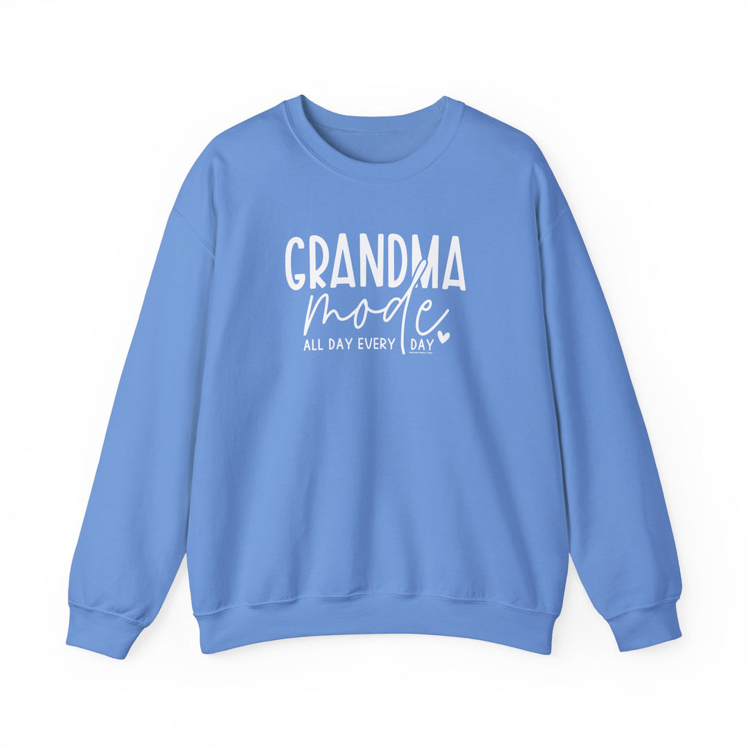 A unisex heavy blend crewneck sweatshirt, Grandma Mode Crew, in blue with white text. Features ribbed knit collar, no itchy side seams, 50% cotton, 50% polyester, loose fit, medium-heavy fabric. Ideal for comfort in various sizes.