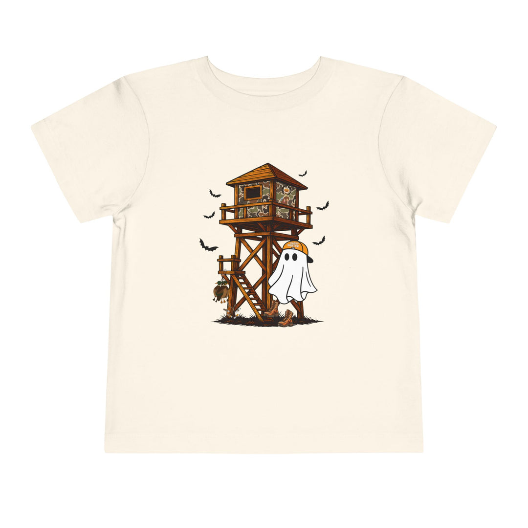 Ghost Hunter Toddler Tee with a Halloween-hunting graphic, featuring a cartoon ghost in an orange cap beside a camo hunting blind, perfect for kids.